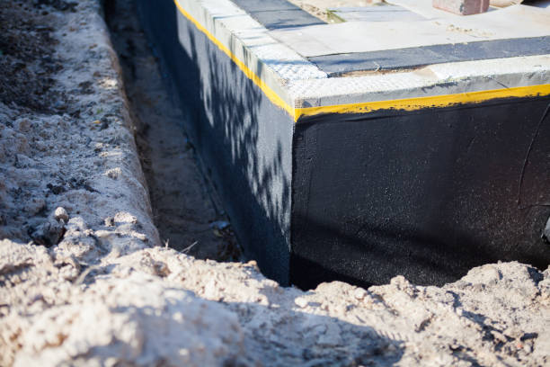 Professional Basement Waterproofing technician working in Millington, TN